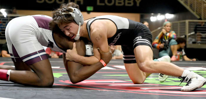 Sebastian Degennaro from Jensen Beach wins a 6-5 battle against Antonie Mills of Mill Creek during the 126-pound championship match on Saturday at the Knockout Christmas Classic at Silver Spurs Arena in Kissimmee.